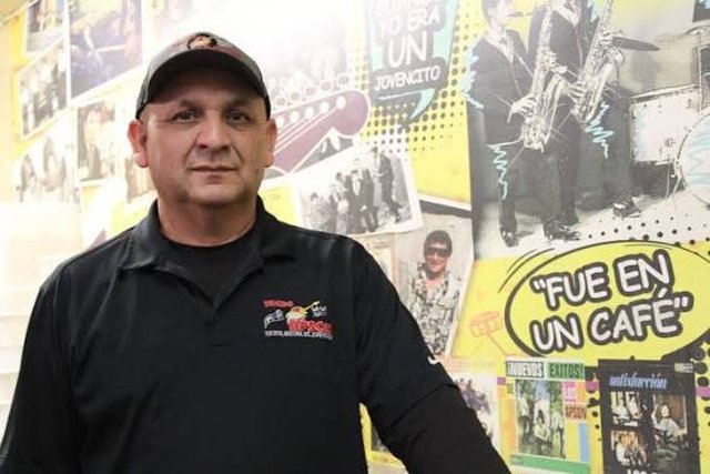 Francisco Durazo Jr. in front of the restaurant's Historia wall