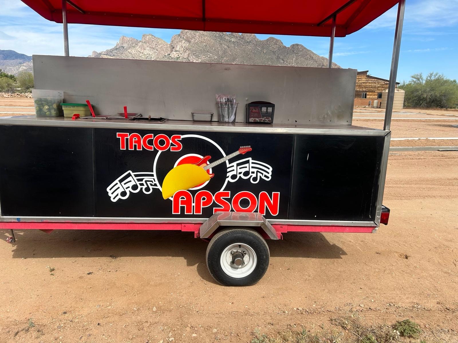 Tacos Apson catering trailer set up outdoors